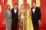 thumbnail: BEVERLY HILLS, CALIFORNIA - MARCH 10: (2nd L-R) Josey McNamara, Margot Robbie and Tom Ackerley attend the 2024 Vanity Fair Oscar Party Hosted By Radhika Jones at Wallis Annenberg Center for the Performing Arts on March 10, 2024 in Beverly Hills, California. (Photo by Amy Sussman/Getty Images)