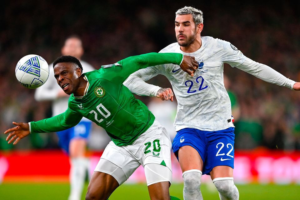 Ireland's Chiedozie Ogbene takes on Theo Hernández of France during the Euro 2024 qualifier