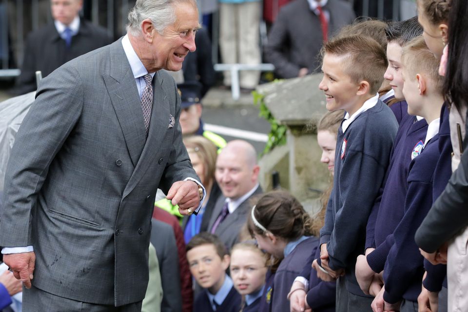 Prince Charles shares a laugh with some local schoolchildren as he arrived with his wife, the Duchess of Cornwall, at The Model Arts Centre in Sligo yesterday. Photo: Frank McGrath