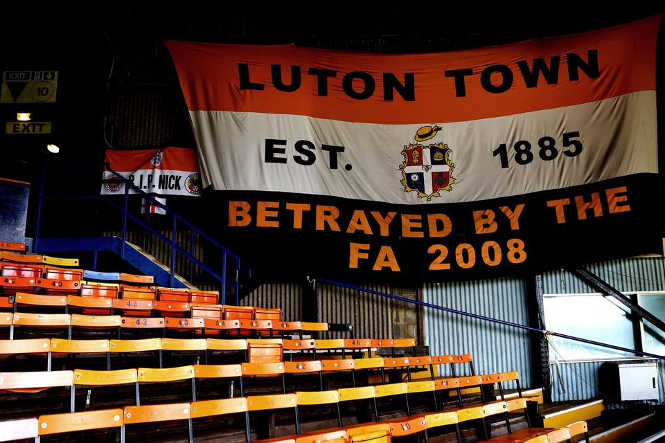 A flag is hung in Luton Town's Kenilworth Road Stadium. Hatters fans still sing about being let down by the FA. Photo: PA