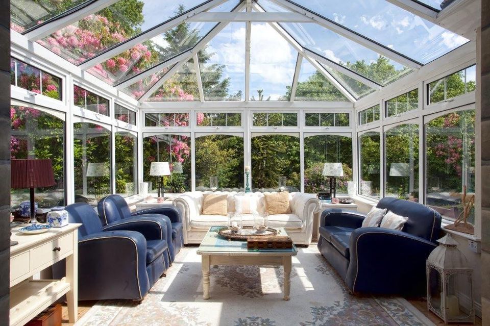 The conservatory has a stone fireplace fitted with an electric fire