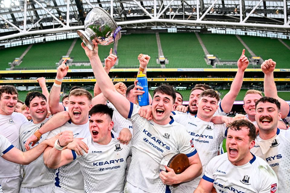 Cork Constitution captain David Hyland lifts the trophy and celebrates with his team-mates after their side's victory in the Energia All-Ireland League Men's Division 1A final against Terenure College. Photo: Seb Daly/Sportsfile