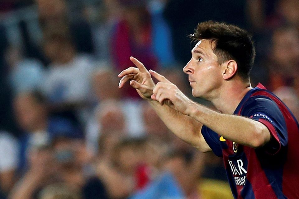 Barcelona's Lionel Messi celebrates after scoring a goal against Ajax Amsterdam during their Champions League soccer match at Camp Nou stadium in Barcelona October 21, 2014. REUTERS/Albert Gea (SPAIN  - Tags: SPORT SOCCER)