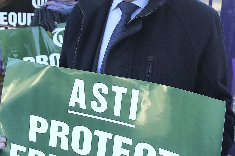 Pat King, general secretary of the ASTI with secondary teachers and members of the ASTI previously on strike outside Rosmini Community school in Drumcondra, Dublin over a junior cycle reform plan. Picture credit; Damien Eagers