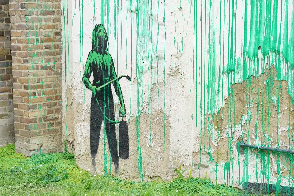 The bright green paint used for the mural matches that used by Islington Council for street signs in the area (Jonathan Brady/PA)