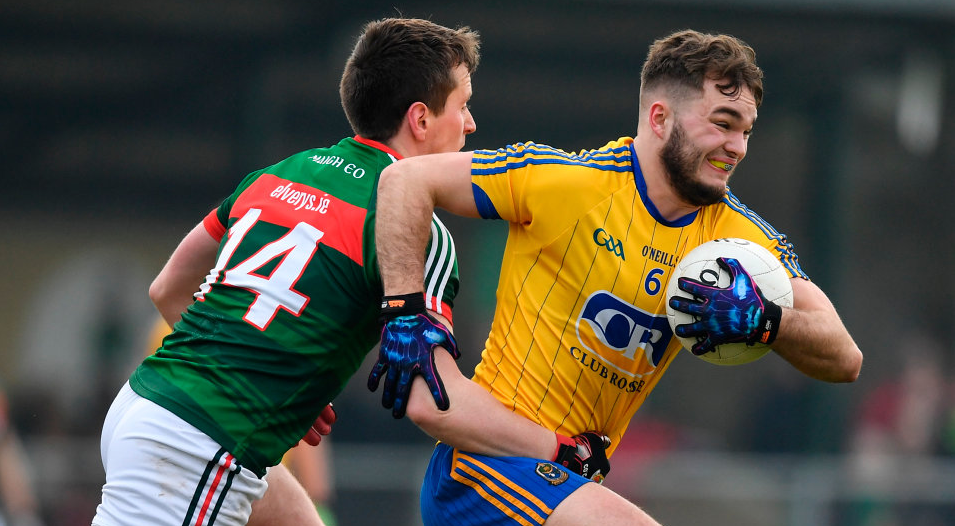 Roscommon's Ultan Harney is tackled by Cillian OConnor of Mayo during the  match at St. Brigids GAA Club.  Photo: Ramsey Cardy/Sportsfile