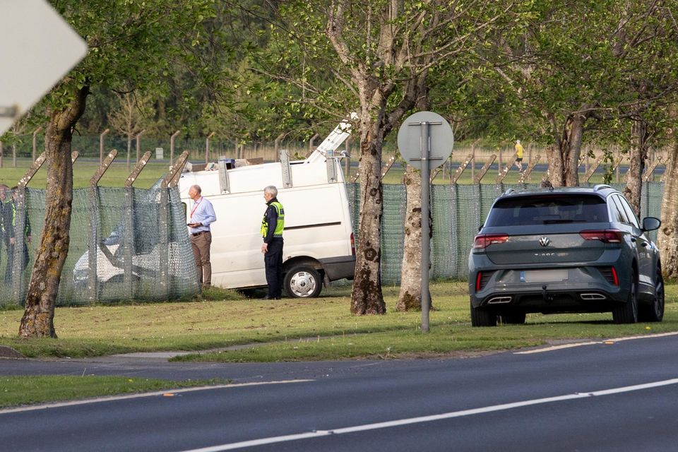 Gardaí and airport police survey the scene after a van crashed through the security fence at Shannon Airport. Photo: Press 22