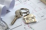 thumbnail: House keys on a house plan blueprint concept for new house design or home improvement