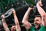 thumbnail: Robbie Henshaw, left, and Jack Conan of Ireland celebrate with the Six Nations and Triple Crown trophies after the Guinness Six Nations Rugby Championship match between Ireland and England at Aviva Stadium in Dublin.