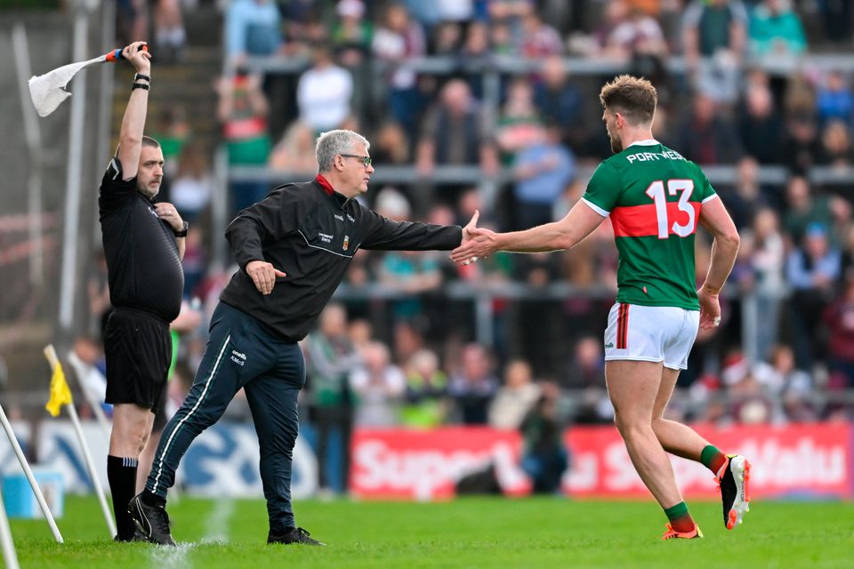 Mayo manager Kevin McStay shakes hands with Aidan O'Shea after O'Shea was substituted off during the Connacht SFC final defeat to Galway