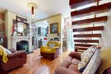 thumbnail: The more traditional living room with its super modern floating stairs