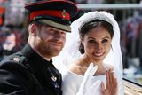 thumbnail: Britain's Prince Harry, Duke of Sussex and his wife Meghan, Duchess of Sussex wave from the Ascot Landau Carriage during their carriage procession on the Long Walk as they head back towards Windsor Castle in Windsor, on May 19, 2018 after their wedding ceremony. (Photo by Aaron Chown / POOL / AFP)