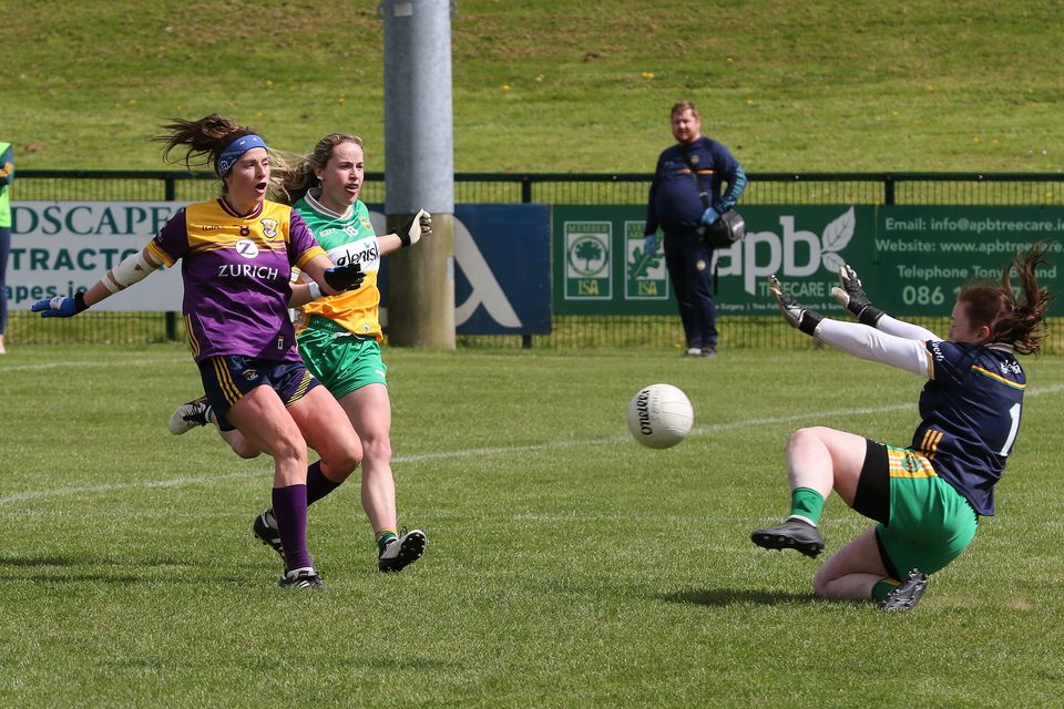 Wexford captain Róisín Murphy beats Lauren Dunne to score her side's goal. Photo: John Walsh
