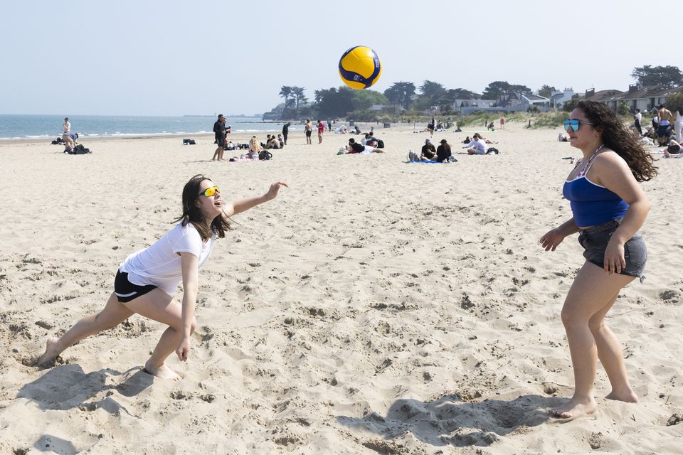 Mila and Likya from Kildare enjoying the sunny weather playing Volleyball on Burrow Beach, Sutton. Photo Sam Boal/Collins Photos