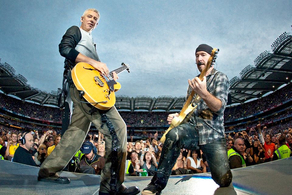 Adam Clayton and The Edge perform on stage for the second night of U2's 360 Degrees World Tour in their home town at Croke Park on July 25, 2009 in Dublin, Ireland.