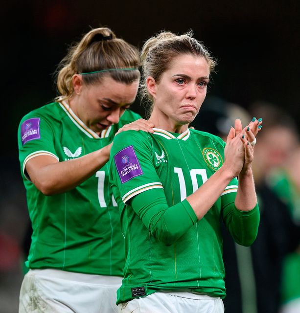 Denise O'Sullivan, right, and Katie McCabe stand dejected after Ireland's defeat to Wales. Photo: Stephen McCarthy/Sportsfile