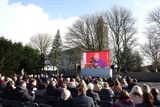 thumbnail: Members of the public seated outside to watch a video feed of the state funeral of former taoiseach John Bruton at St Peter and Paul’s Church, Dunboyne, Co Meath. Photo: Julien Behal/Government Information Service