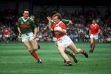 thumbnail: Teddy McCarthy of Cork in action against Jimmy Browne, left, and Peter Ford of Mayo during the 1989 All-Ireland Senior Football Championship Final at Croke Park in Dublin. Photo by Ray McManus/Sportsfile