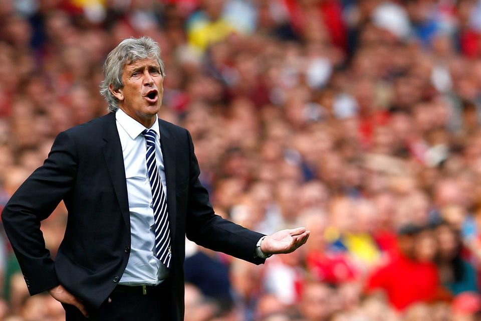 Manchester City's manager Manuel Pellegrini reacts during their Premier League match against Arsenal at the Emirates stadium
