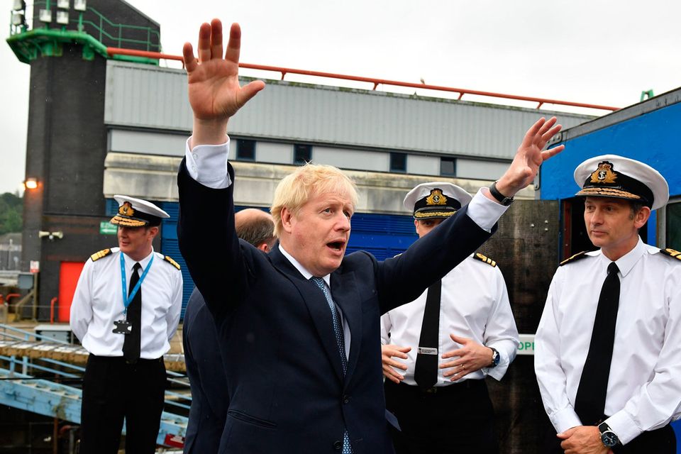 Gesturing: Boris Johnson visits HMS Victorious at the Faslane Naval Base on the River Clyde in Scotland.  Photo: Jeff J Mitchell/PA Wire