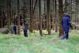 thumbnail: Gardaí search a wooded area on Ballinascorney Hill where the body of Michael McCoy was found last September Picture: Collins