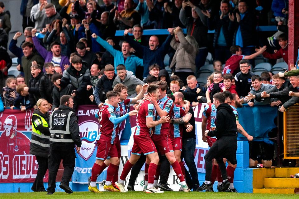 Hayden Cann of Drogheda United, hidden, celebrates with teammates after scoring their side's winning goal during the SSE Airtricity Premier Division match against Dundalk at Weavers Park in Drogheda, Louth. Photo: Ben McShane/Sportsfile