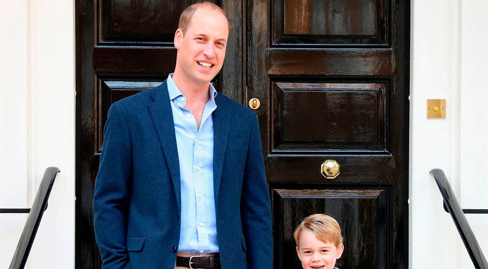 Handout photo released by the Duke and Duchess of Cambridge of the Duke of Cambridge with his son Prince George on his first day of school