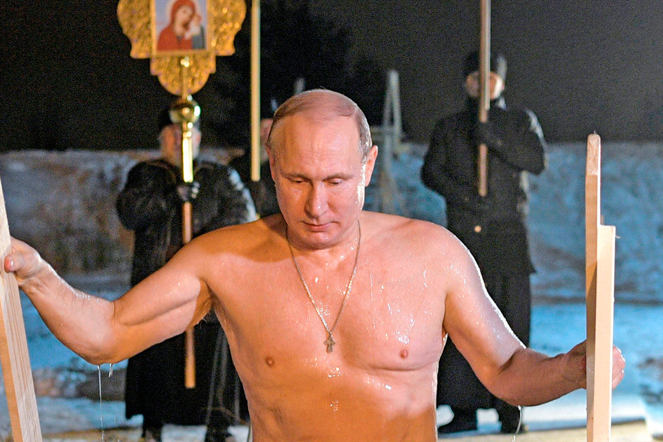 Russian President Vladimir Putin bathes in ice-cold water on Epiphany. Photo: PA