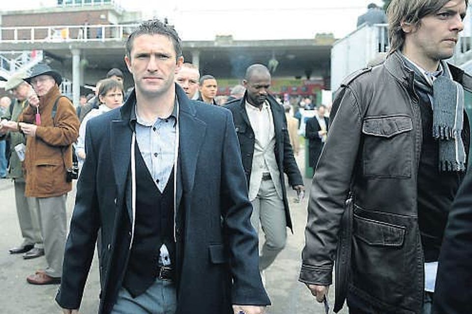 Ireland captain Robbie Keane arrives with his Spurs teammate Jonathan Woodgate