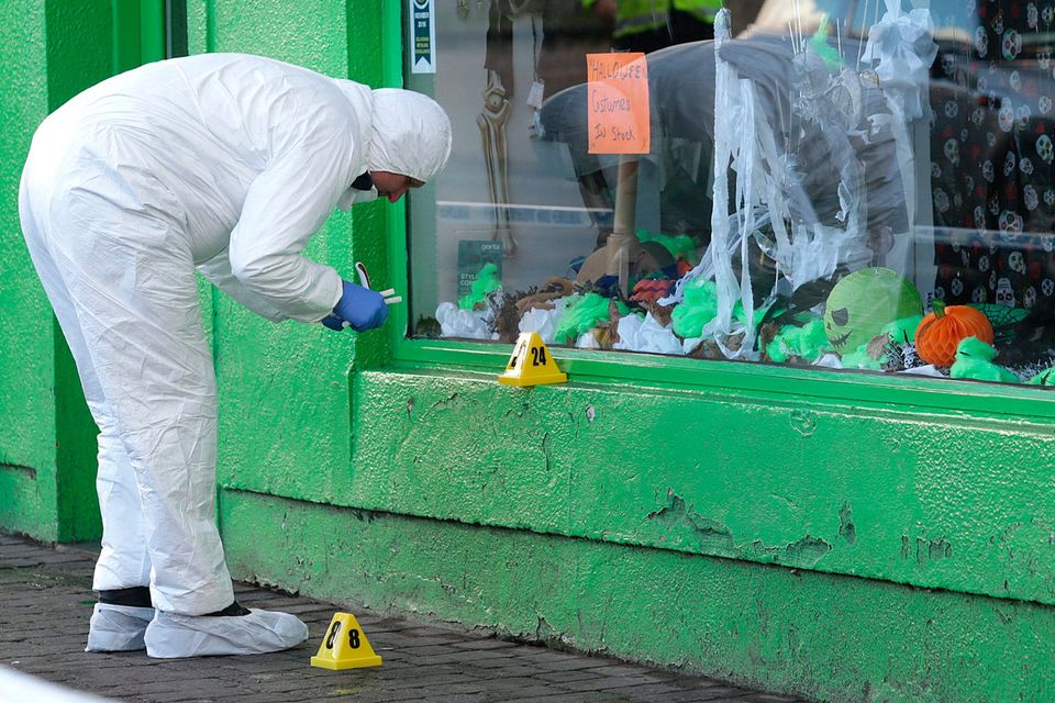 A forensic officer at work at the scene yesterday PHOTO: DAMIEN EAGERS