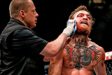 thumbnail: Conor McGregor is treated for a cut over the right eye at the end of the first round