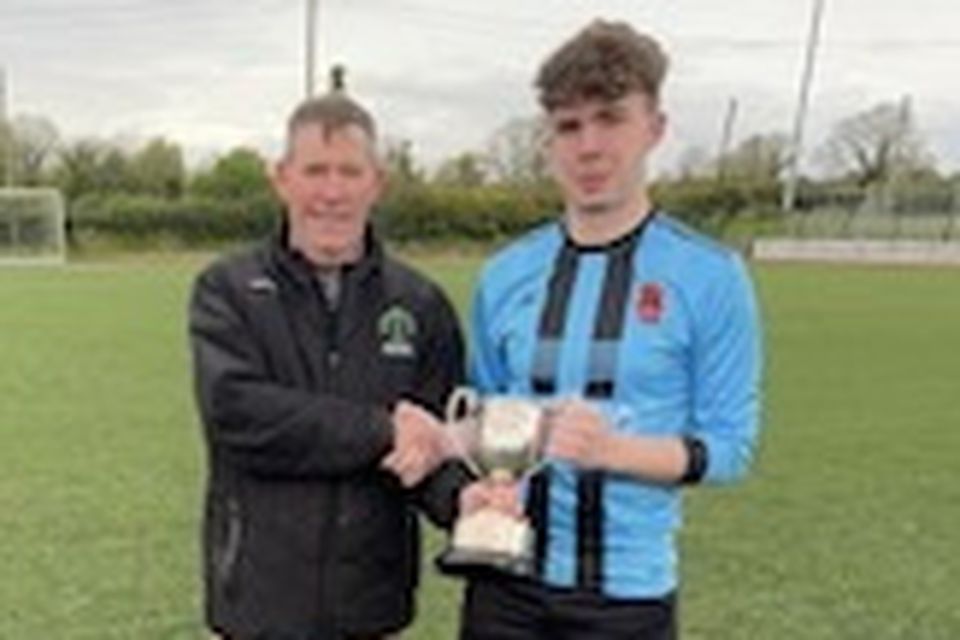 St Brendan's Park captain and goalkeeper Luke O'Regan received the Jimmy Falvey Memorial Cup from KDL chairman Sean O'Keeffe