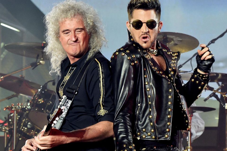 Brian May of Queen with singer Adam Lambert standing in for the late Freddie Mercury. Photo by Kevin Winter/Getty Images