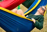 thumbnail: Festival-goers relax in hammocks during day one of Glastonbury Festival at Worthy Farm, Pilton on June 26, 2019 in Glastonbury, England. (Photo by Leon Neal/Getty Images)
