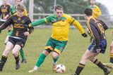 thumbnail: Rathnew's John Lester takes on the Carnew defence.