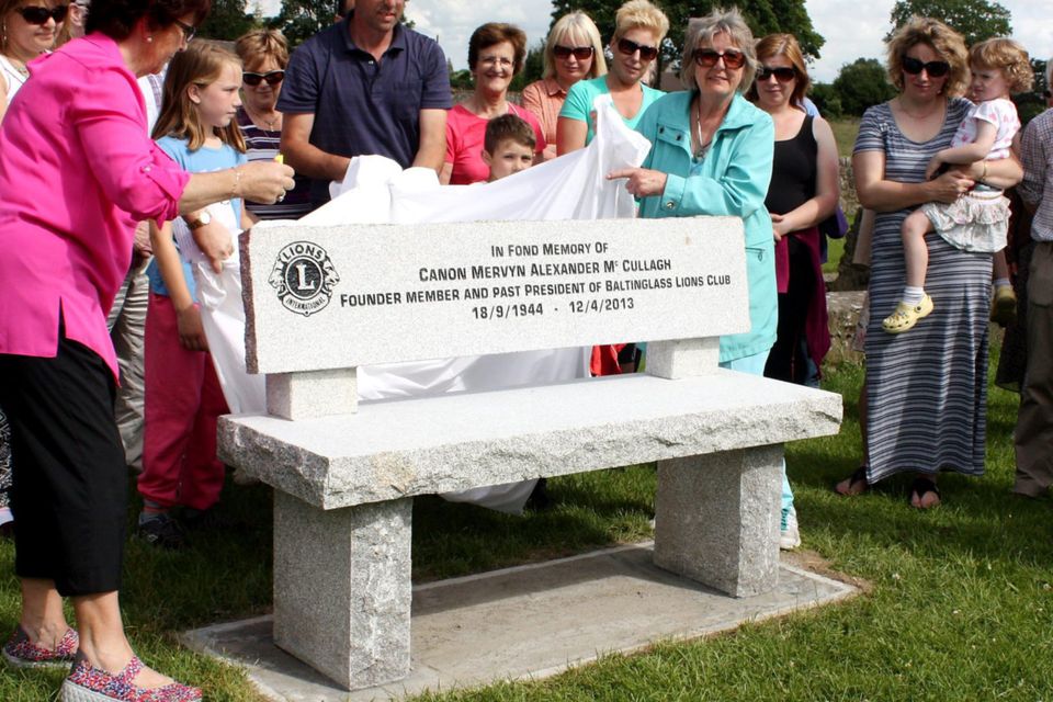 Mary Ross and Hilary McCullagh unveil the bench at the Weir last Sunday to remember Canon Mervyn McCullagh.