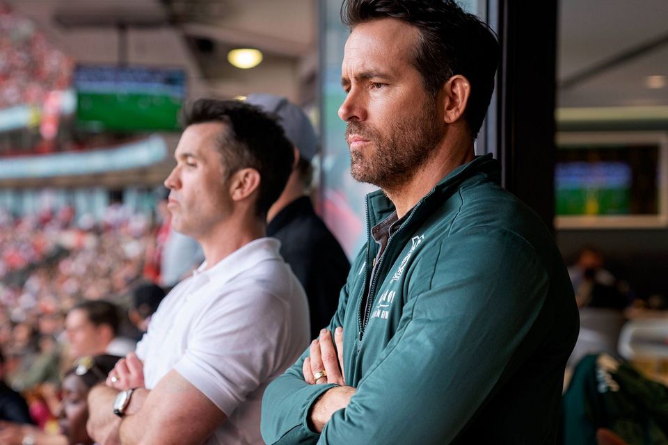 As Wrexham AFC’s progress shows, Rob McElhenney (left) and Ryan Reynolds’ ownership of the club is no mere celebrity indulgence. Photo: Disney+/FX