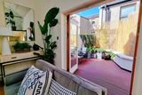 thumbnail: The living room opens out on to the patio garden