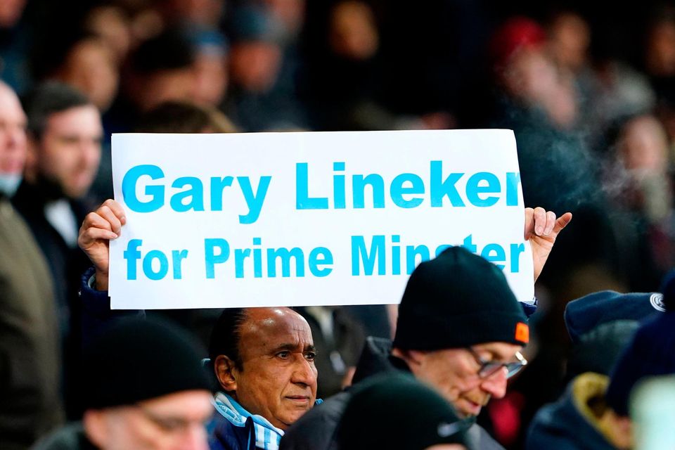 A Manchester City fan holds up a sign in support of Match of the Day presenter Gary Lineker ahead of the Premier League match at Selhurst Park, London