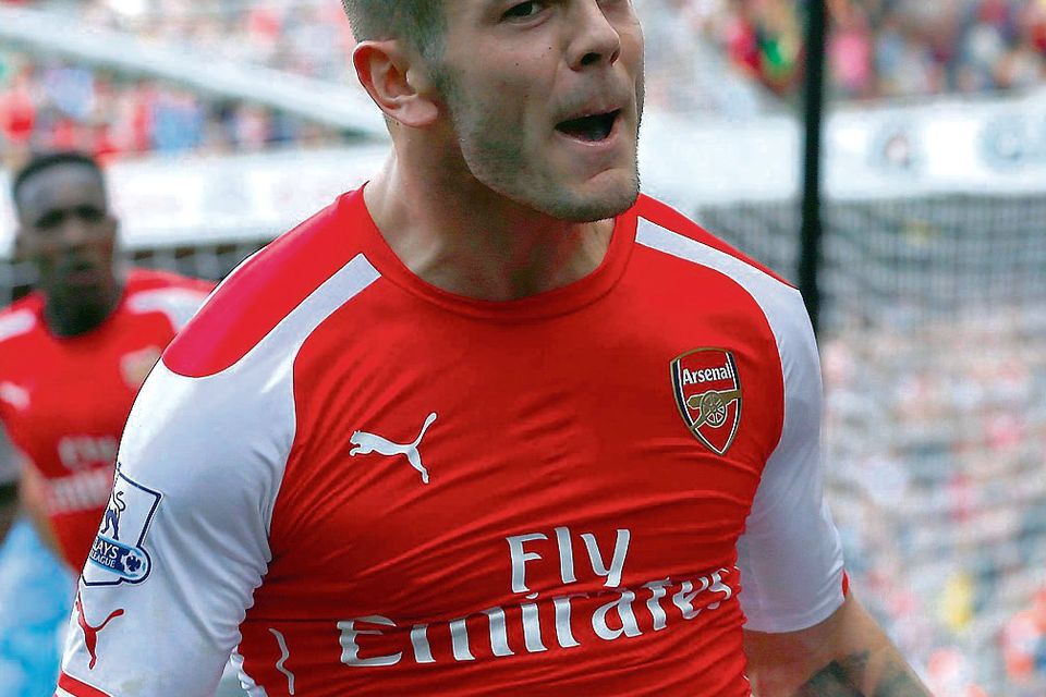 Arsenal's Jack Wilshere celebrates after scoring a goal against Manchester City