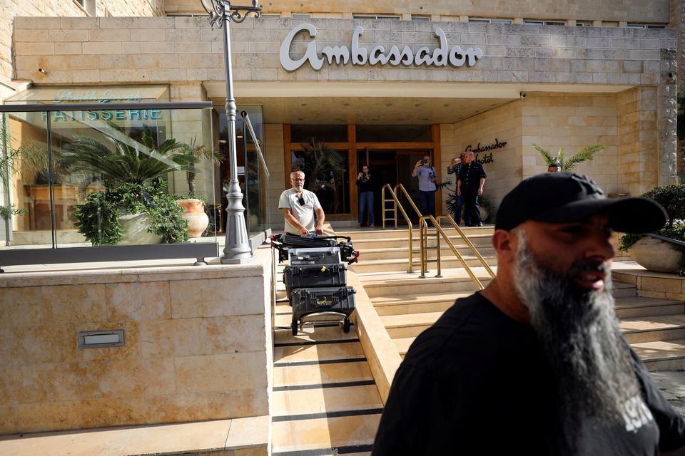 A man manoeuvres media equipment following an Israeli police raid on an Al Jazeera's de facto office at the Ambassador Hotel in Jerusalem yesterday. Photo: Jamal Awad/Reuters
