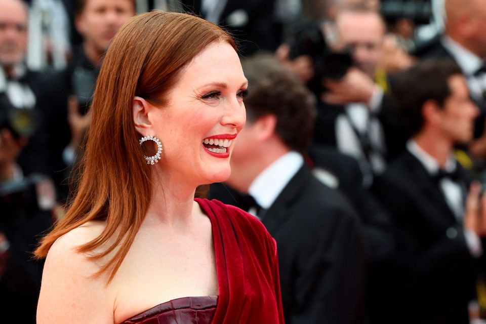 US actress Julianne Moore poses as she arrives for the screening of the film "Mad Max : Fury Road" during the 68th Cannes Film Festival