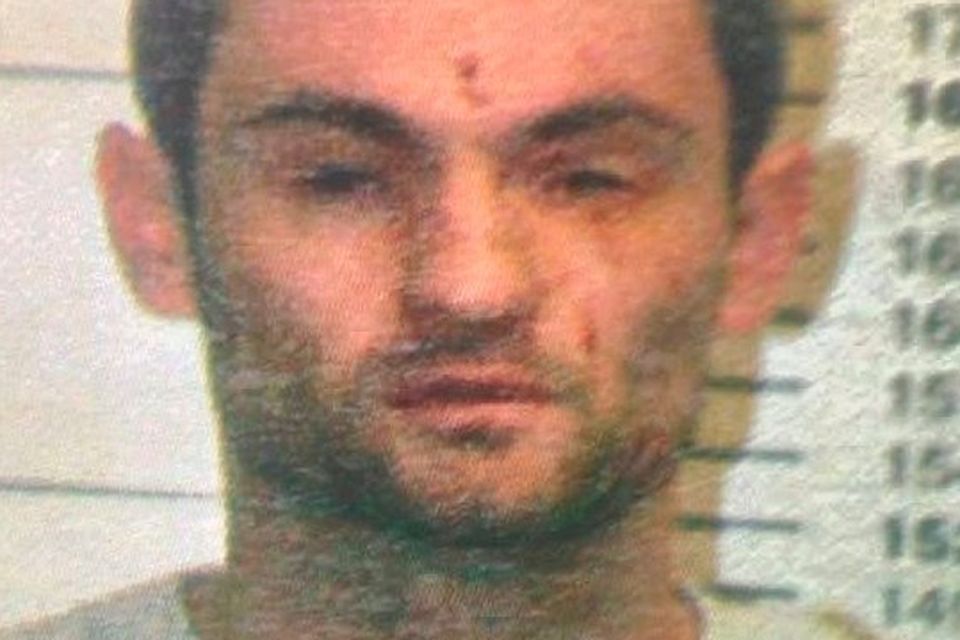 Scratches and marks are visible on Locke’s face in this garda mugshot