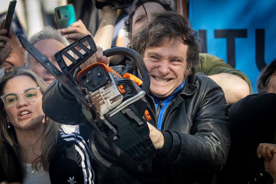 Javier Milei wields a chainsaw while campaigning in Buenos Aires Photo: Tomas Cuesta
