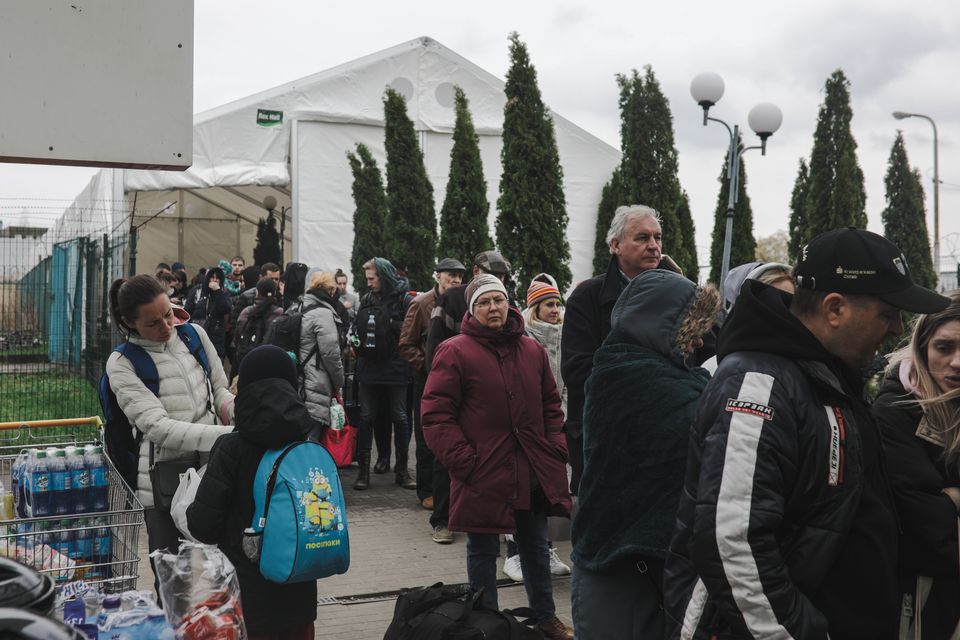 Ukrainian refugees cross the Polish border at Medyka in April last year. Photo: Gian Marco Benedetto