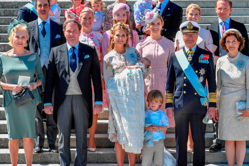 Sweden's Princess Madeleine, left holding Prince Nicolas stands next to her  husband Christopher O'Neill holding their daughter Princess Leonore, with  Queen Silvia and King Carl XVI Gustaf at right, during the christening