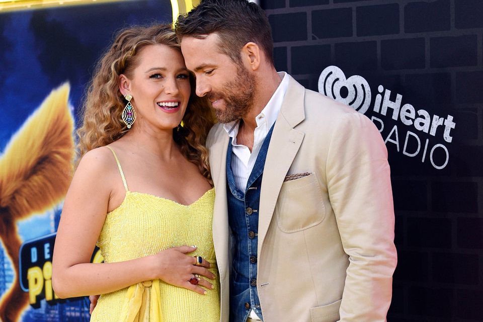 Actor Ryan Reynolds, right, is joined by his pregnant wife, actress Blake Lively at the premiere of "Pokemon Detective Pikachu" at Military Island in Times Square on Thursday, May 2, 2019, in New York. (Photo by Evan Agostini/Invision/AP)