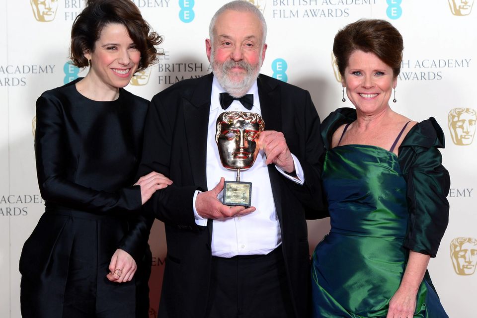 Mike Leigh with the Fellowship Award, alongside Sally Hawkins and Imelda Staunton (right), at the EE British Academy Film Awards at the Royal Opera House, Bow Street in London. PRESS ASSOCIATION Photo. Picture date: Sunday February 8, 2015. See PA story SHOWBIZ Bafta. Photo credit should read: Dominic Lipinski/PA Wire
