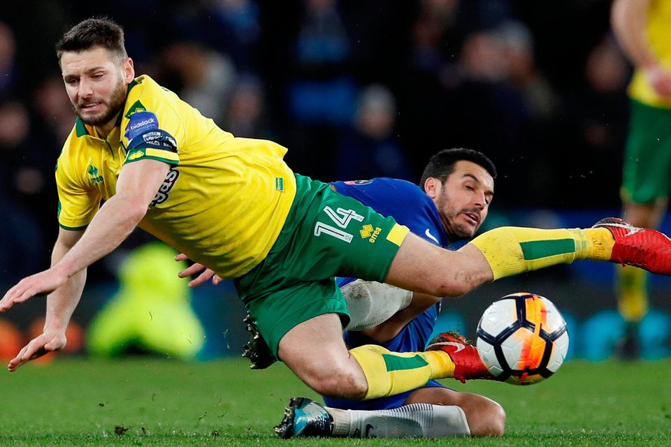 Chelsea's Pedro fouls Norwich City's Wesley Hoolahan resulting in him receiving his second yellow card and being sent off