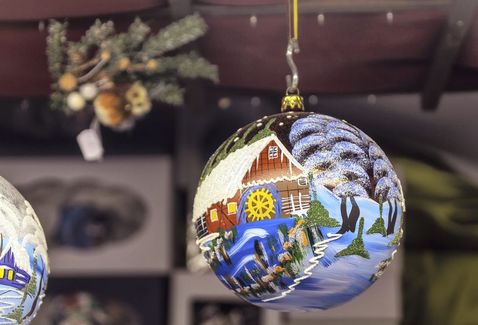 A Christmas bauble hangs at a market in Vienna.